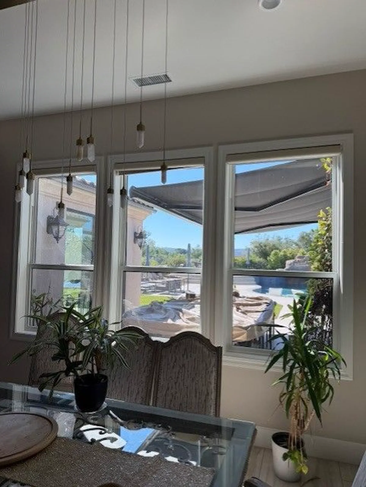 Clean window screen and frame detail on a California home